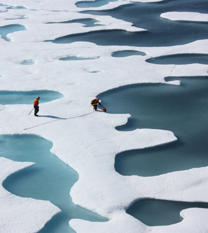 Melt ponds form when water pools on ice sheets. They absorb more heat than the surrounding ice. (Credit: NASA/Kathryn Hansen)