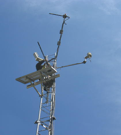 Working on a Smart Forest sensor tower at Marcell Experimental Forest in Minnesota (Credit: Nick Grant, U.S. Forest Service)