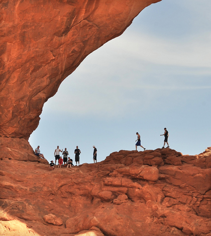 Visitors in Arches National Park in Moab, Utah (Credit: Emilio Labrador, via Flickr)