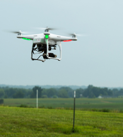 Southeast Missouri State University students use the "Ag Force One" drone to monitor crops (Credit: Marcus Painton)