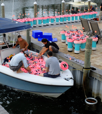 Loading up current-tracking GPS drifters for use in the Gulf of Mexico (Credit: Tamay Özgökmen)