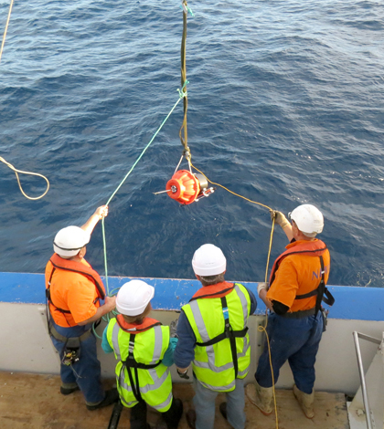 Deploying the water-monitoring robot floats (Credit: Learns)