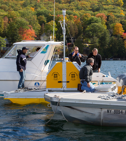 A crew launches one of five water quality profilers planned for Lake George. (Credit: Rensselaer Polytechnic Institute)