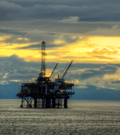 An oil rig offshore of Surfside, California (Credit: Neil Kremer, via Flickr/CC BY-ND 2.0)