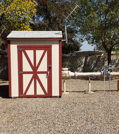 A shed houses the real-time monitoring equipment at a public supply well in Fresno, California. (Credit: Justin Kulongoski)