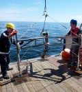 Researchers prepare to deploy a lander. (Credit: Daniel McGinnis)