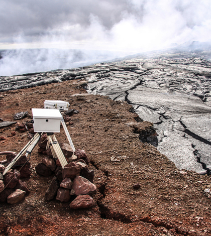 A Kilauea lava flow creeping dangerously close to USGS monitoring equipment. (Credit: USGS)