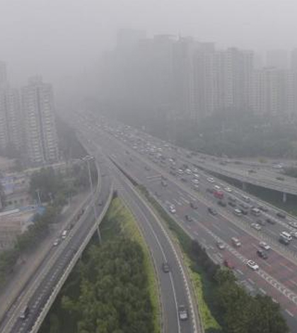 While smog levels remain high, the Chinese Environmental Protection Agency announced a drop in 2014. (Credit: Jason Lee / Reuters)