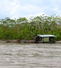 A small-scale gold mining operation docks along the Madre de Dios River in Peru in June 2013. (Credit: Sarah Diringer)