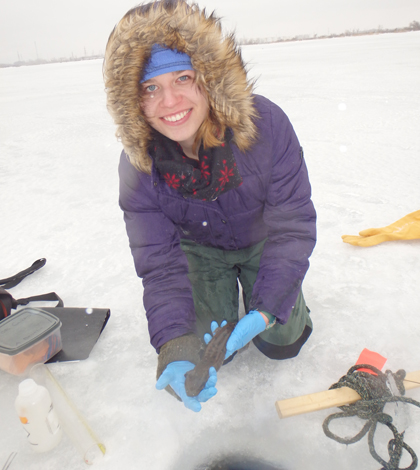 Graduate Student, Alicia Beattie, holding a threatened mudpuppie. (Courtesy Southern Illinois University Carbondale)