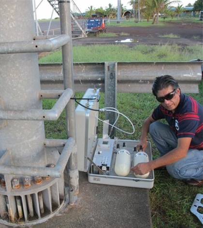 Chilean meteorologist collects air samples for NOAA's Global Greenhouse Gas Monitoring Network. (Credit: NOAA)