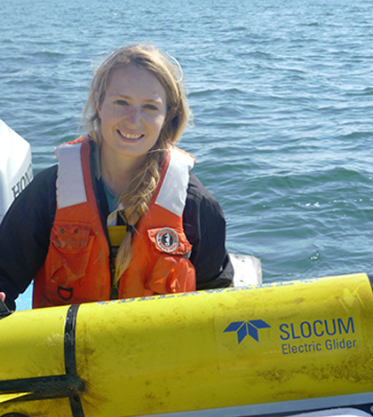 Danielle Haulsee, a doctoral student in the College of Earth, Ocean, and Environment at University of Delaware, with an underwater robot used to track sand tiger sharks. (Credit: University of Delaware)