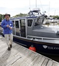 Thomas Bridgeman, associate professor of ecology at the University of Toledo, showed the new research vessel during a dedication ceremony. (Credit: Amy E. Voigt / The Blade)