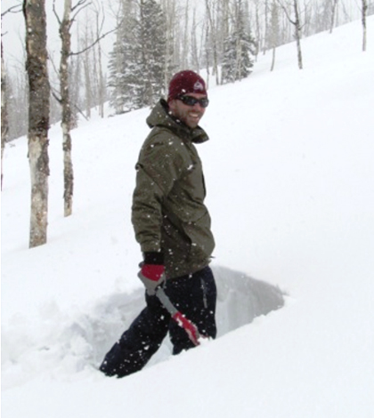 Ryan Webb digs a snow pit at a research site in northwestern Colorado. (Credit: Niah Venable)