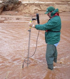A USGS hydrographer measures flow in Short Creek after the flood event. (Credit: Jake Benson / USGS)