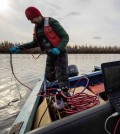 arctic ocean / Paul Mann, Northumbria U., takes biochar samples using a research boat, Kolyma River, Siberia. (Credit: Aron Stubbins)