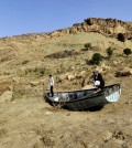 Two men inspect an abandoned boat in Yemen, one of the countries most affected by the scarcity of freshwater. (Credit: Yahya Arhab / EPA)