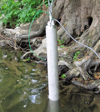 An earlier version of the in-situ sampling device. The lower portion of the tubular instrument is submerged in sediment while the upper portion is exposed to pore water. (Credit: Arizona State University)