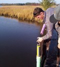 A field biologist with the Maryland Department of Natural Resources deploys a YSI water quality sonde. (Credit: Brian Smith / Maryland Department of Natural Resources)
