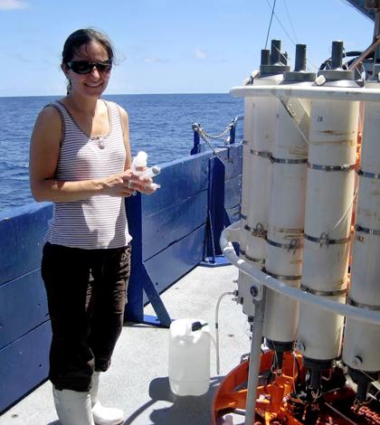Angela Knapp stands next to a niskin rosette that was used to take water samples at various depths in the eastern South Pacific Ocean. (Credit: Florida State University)