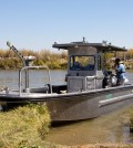 The U.S. Geological Survey R/V Mary Landsteiner shown at a brief stop during a study in the Northern San Francisco estuary. USGS scientist Bryan Downing is shown calibrating the on-board, real-time underway measurement system. (Credit: Stephen de Ropp for the U.S. Geological Survey)