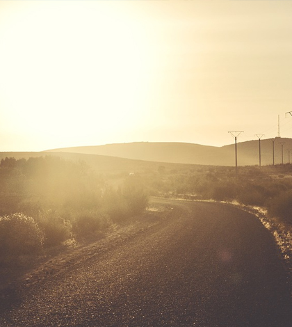 Sunlight on a stretch of road. (Credit: Public Domain)