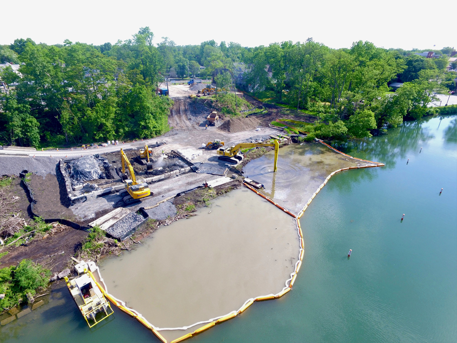 dredging in a contained area of a lake. It is separated by yellow barriers