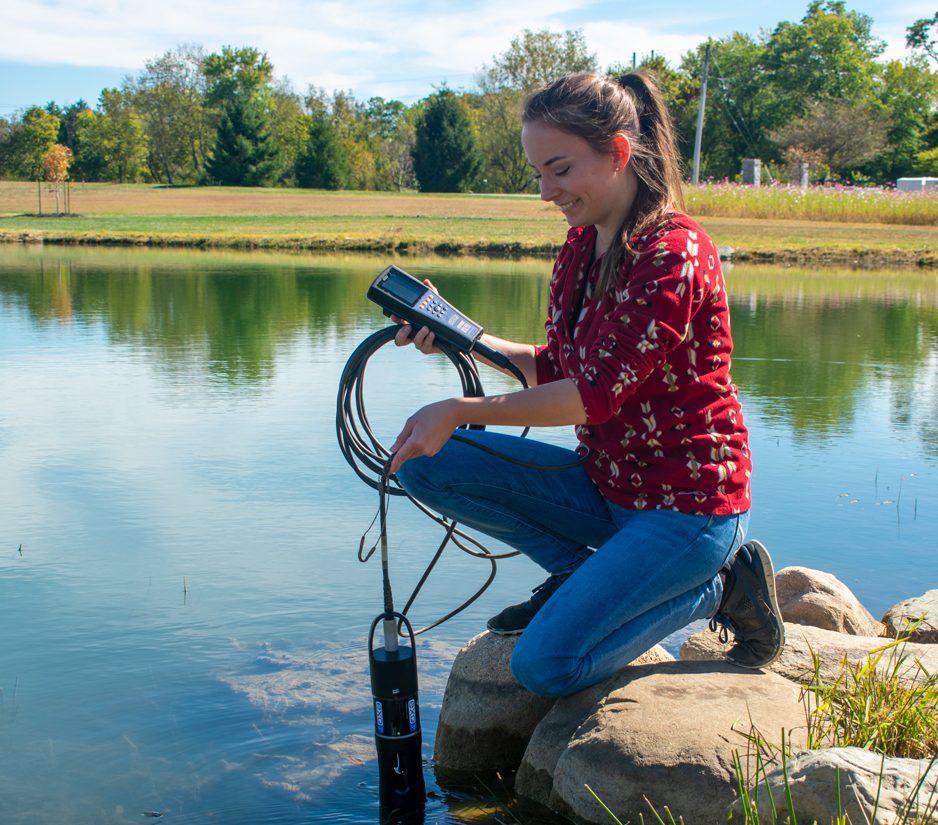 Environmental scientist, Emily Holliday, sampling water with the YSI EXO3s at the Fondriest Environmental Inc., Field Station