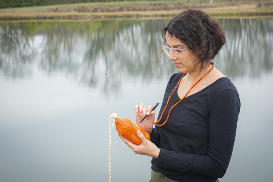 scientist holds the Sontek CastAway-CTD shoreside at the Fondriest Environmental, Inc. Field Station