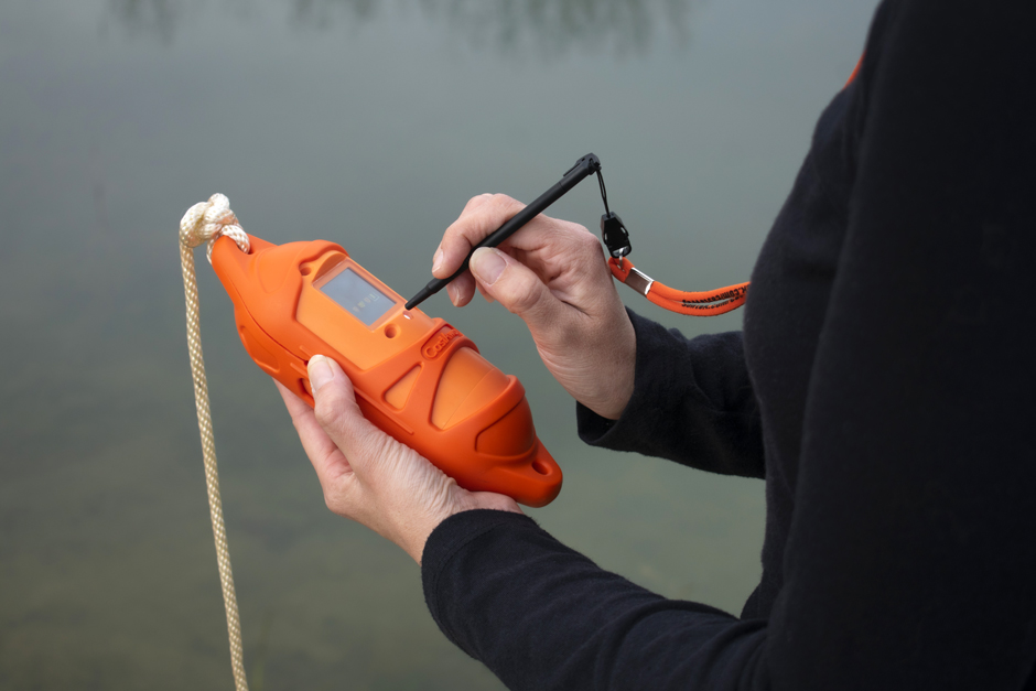 scientist holds the Sontek CastAway-CTD shoreside at the Fondriest Environmental, Inc. Field Station