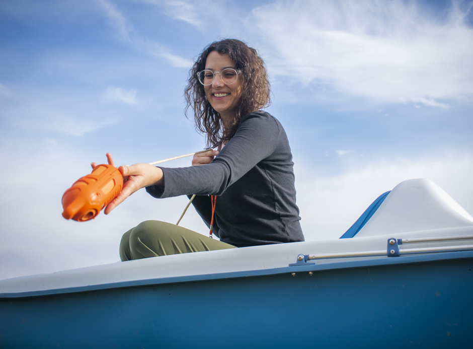 scientist holds the Sontek CastAway-CTD boatside at the Fondriest Environmental, Inc. Field Station