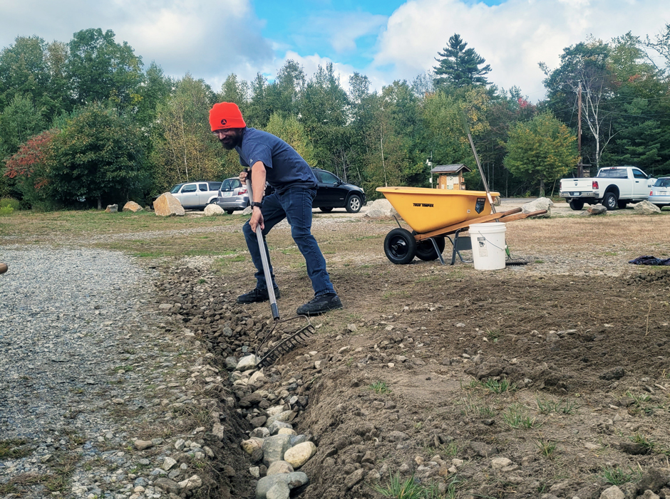 AmeriCorps Watershed Steward, Anthony Jaster, works to maintain an infiltration trench at the Grey Rock Conservation Area. Small-scale stormwater installations protect water quality by slowing down, capturing, and directing runoff away from water bodies to areas where it can infiltrate into the ground.