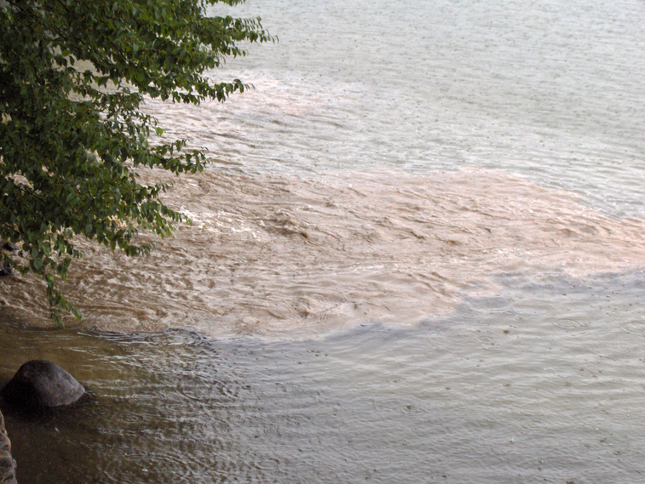 Sediment pollution from upland development entering Newfound Lake during a storm event. Stormwater carries sediment, pet waste, household chemicals, and nutrient pollution with it—negatively impact ecosystem function.