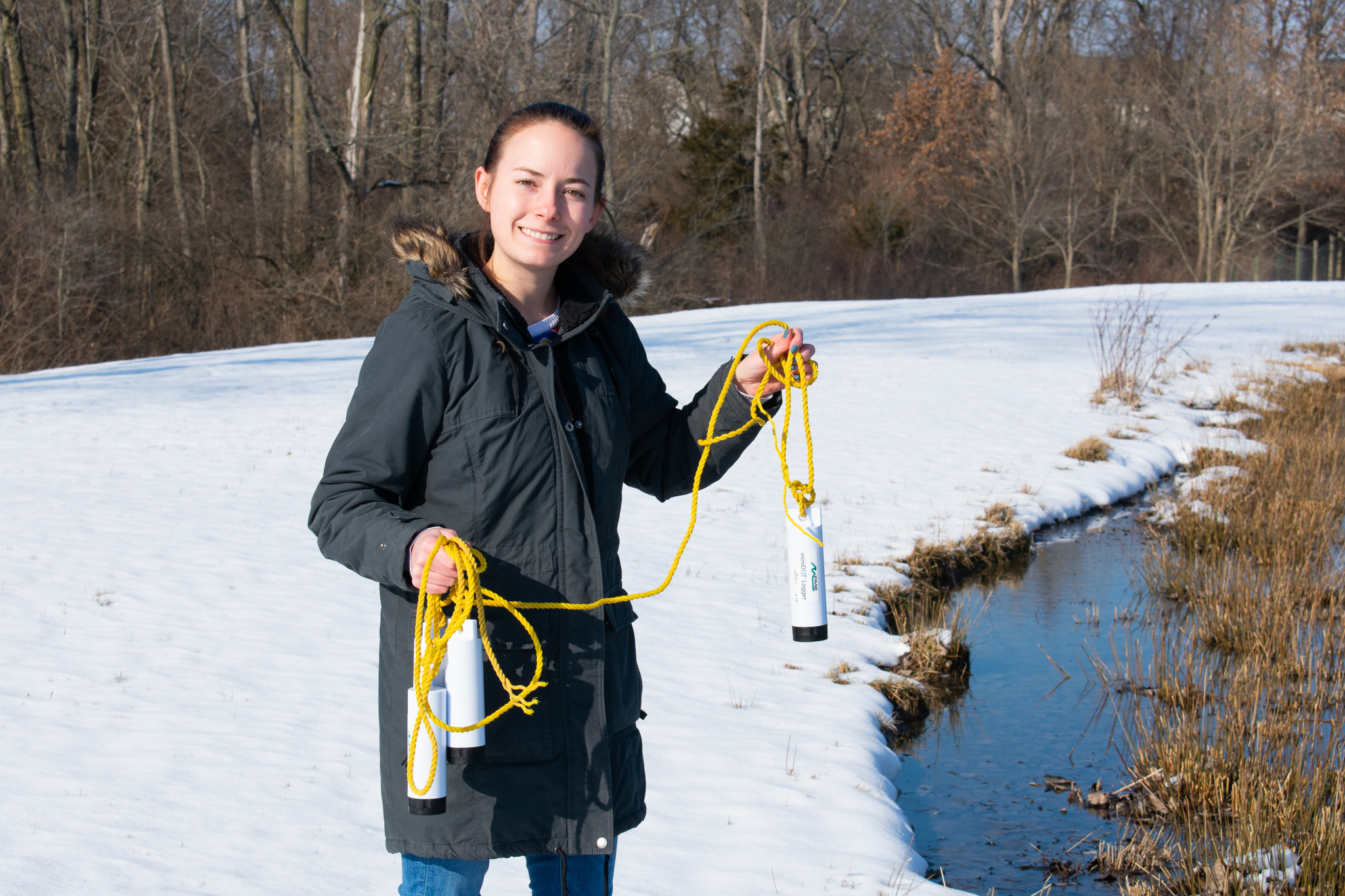 Environmental Scientist, Emily Holliday, getting ready to deploy four PME miniDOT Loggers at the Fondriest Center for Environmental Studies.