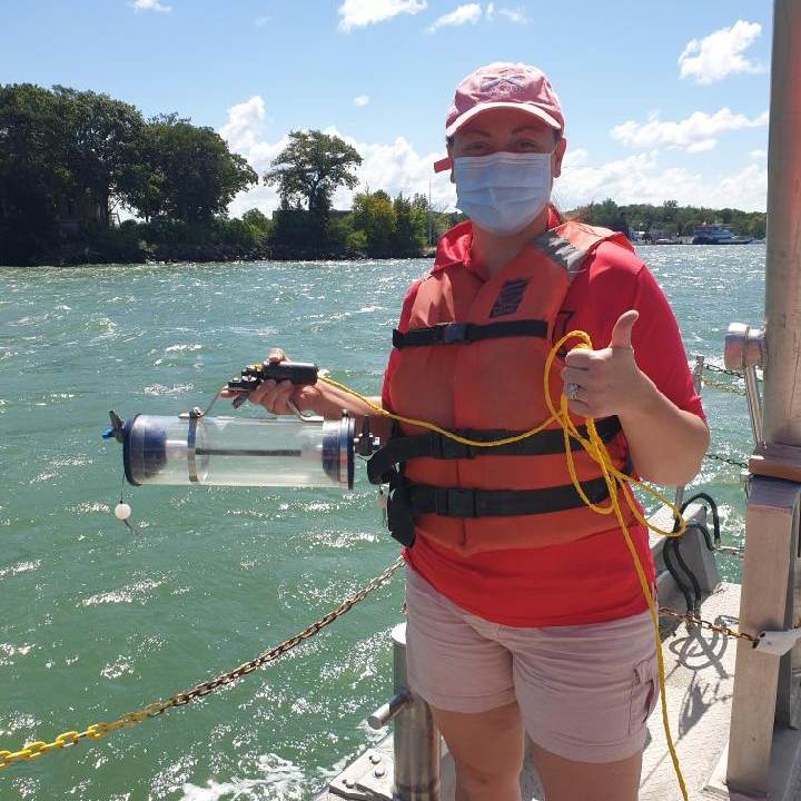 PhD candidate Lauren Knose collects water from Maumee Bay in Lake Erie. Western Lake Erie is plagued by harmful algal blooms. Knose’s research investigates the role of dissolved organic matter in controlling the frequency and toxicity of these blooms. 