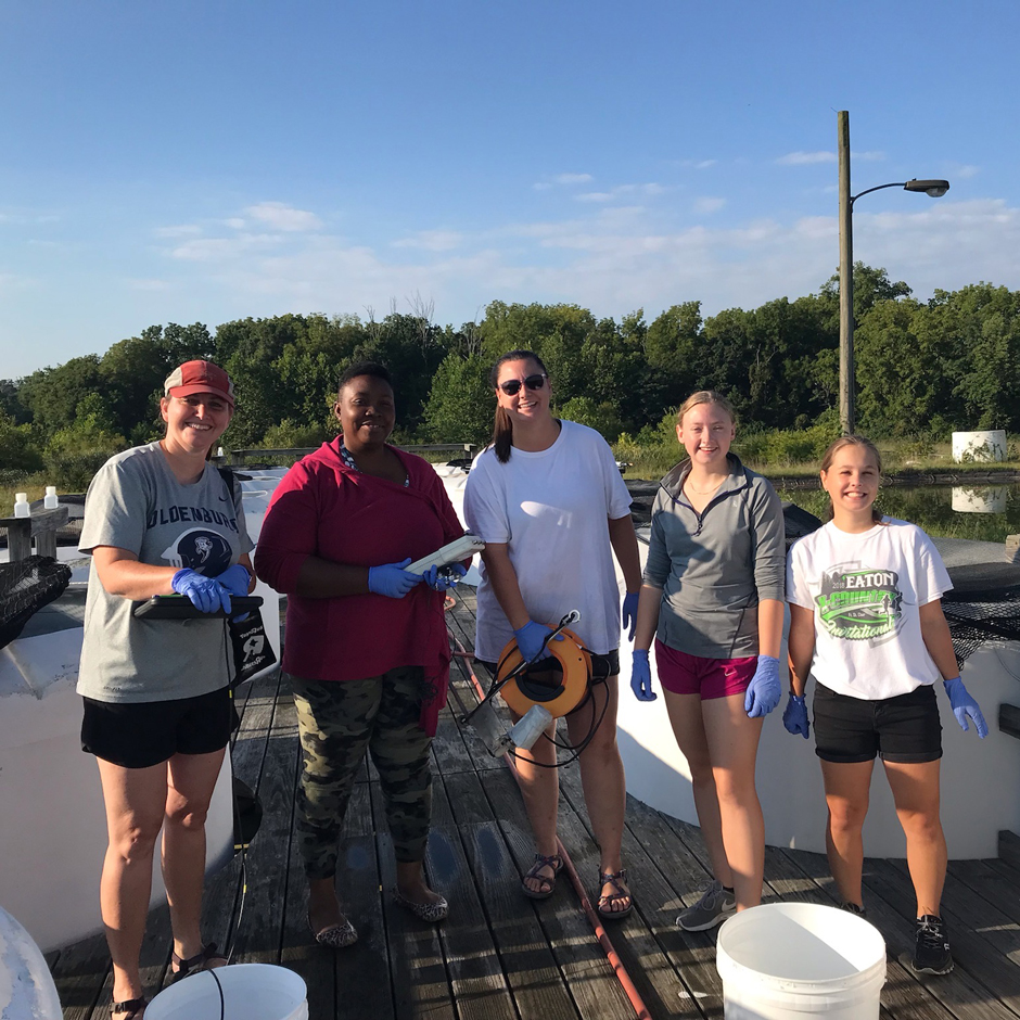 PhD candidate Nicole Berry measures water transparency using an underwater radiometer. The offshore regions of Lakes Michigan and Huron are increasing in transparency. This may expose the early life stages of fish to damaging ultraviolet radiation