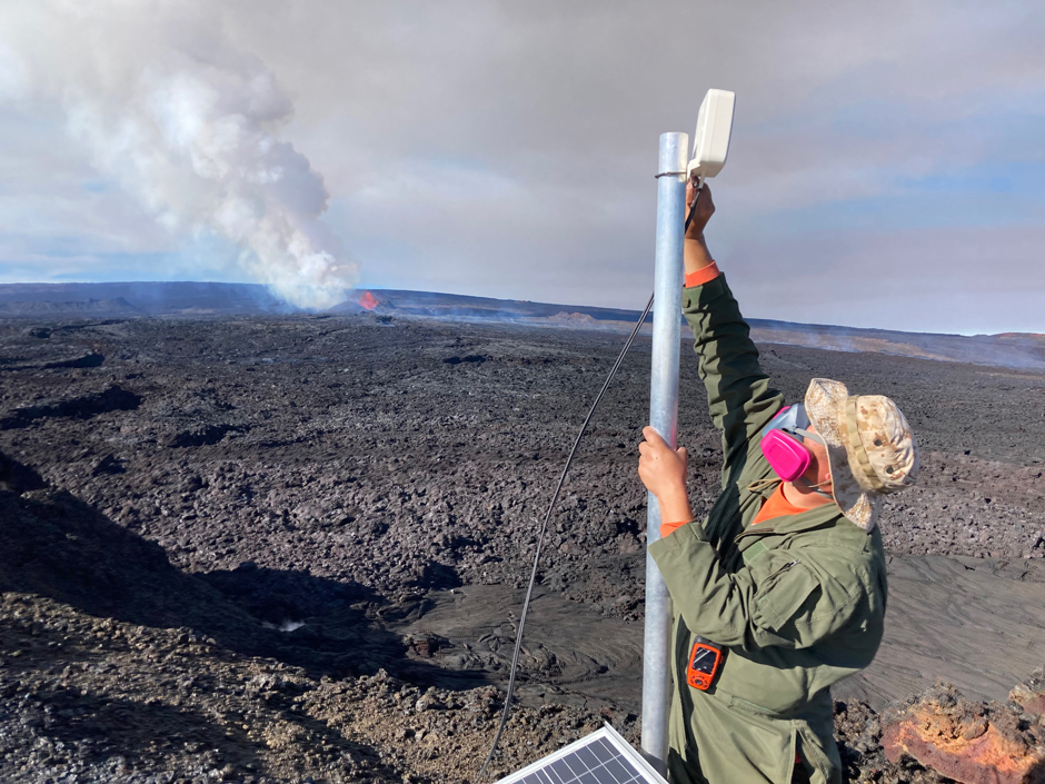 An HVO scientist installs a webcamera to monitor the Northeast Rift Zone eruption of Mauna Loa