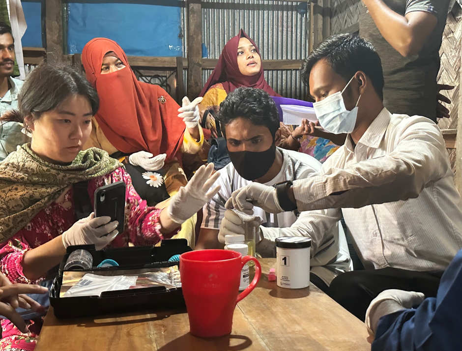 A group of volunteers from Chemists Without Borders arsenic testing water samples collected from wells in Teriail, Bangladesh, earlier this year.