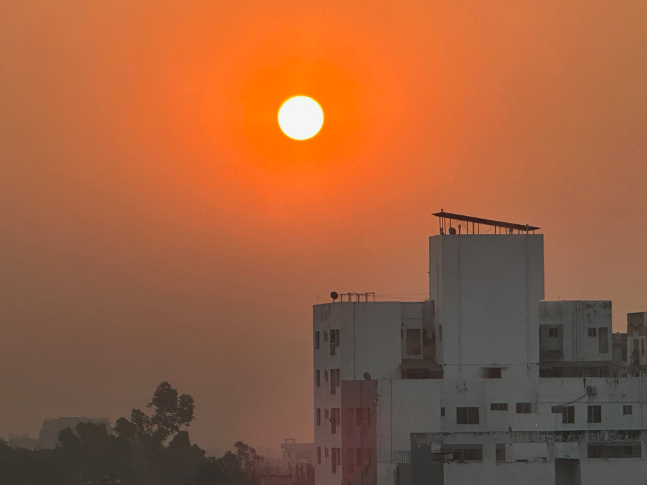 The sun rises over a hazy sky in Dhaka, Bangladesh, during Kurkjian and Karanian’s visit earlier this year. 