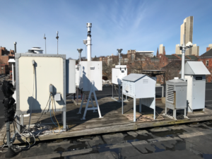 rooftop air monitoring site with DEC and DOH equipment.
