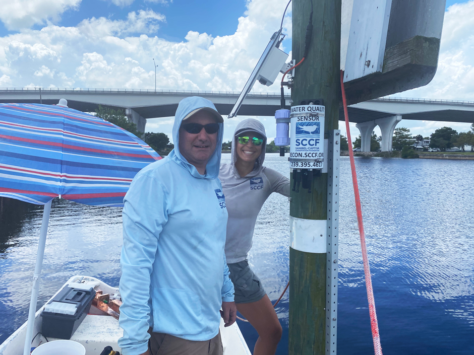 Marine Lab Manager AJ Martignette and Research Assistant Sierra Greene installing the Moore Haven RECON station. 