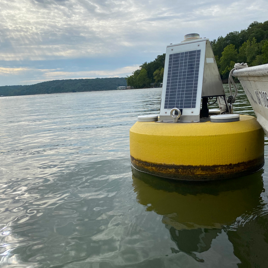 A Nexsens data buoy housing a multiparameter sonde used to help predict and identify algal blooms sits in the Fly Creek arm of Grand Lake in NE Oklahoma. 