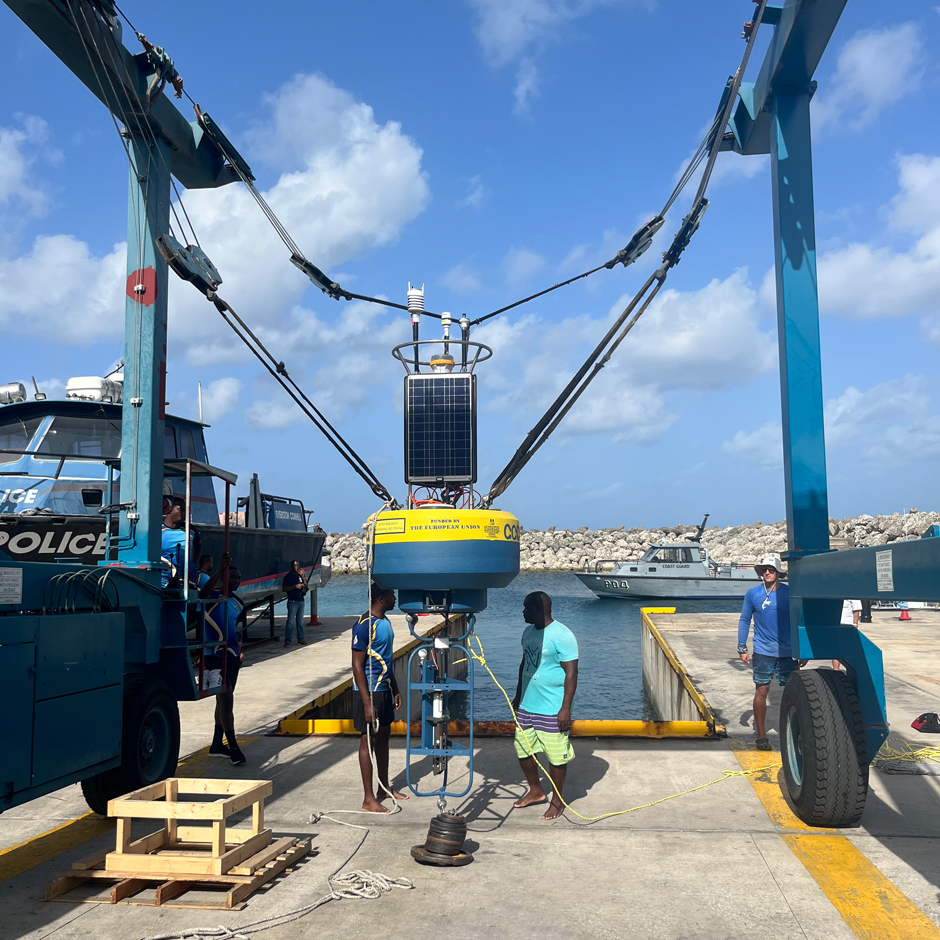 A CB-950 being lifted by a crane for deployment at the Coast Guard Base in Barbados