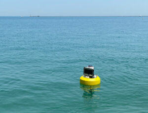 CB-75-SVS buoy deployed off the shore of Chicago with a view of Lake Michigan.