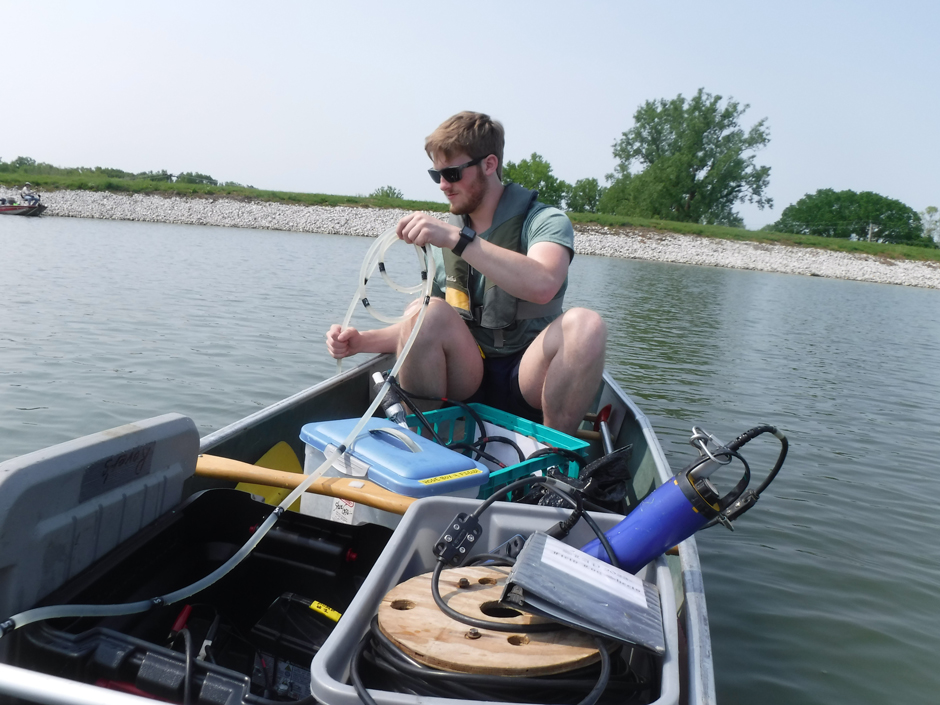 School of Natural Resources undergraduate student- Jacob Skipton- collects water samples from a Missouri reservoir. 