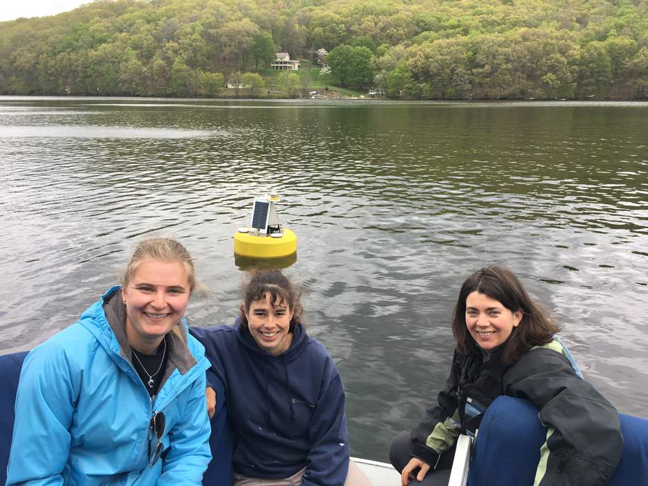FOTL members Kendra Kilson, Rebekah White, and Fairfield University professor Jen Klug pose with the buoy.