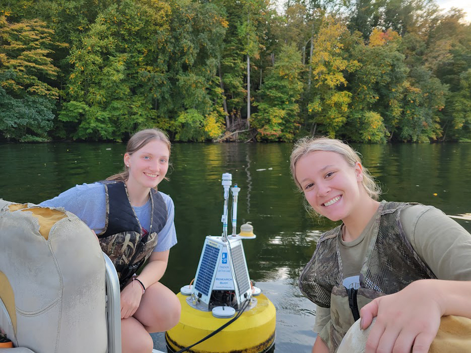 Fairfield University biology majors, Olivia Beaudoin and Emma Kramer (left) pose with the buoy. 