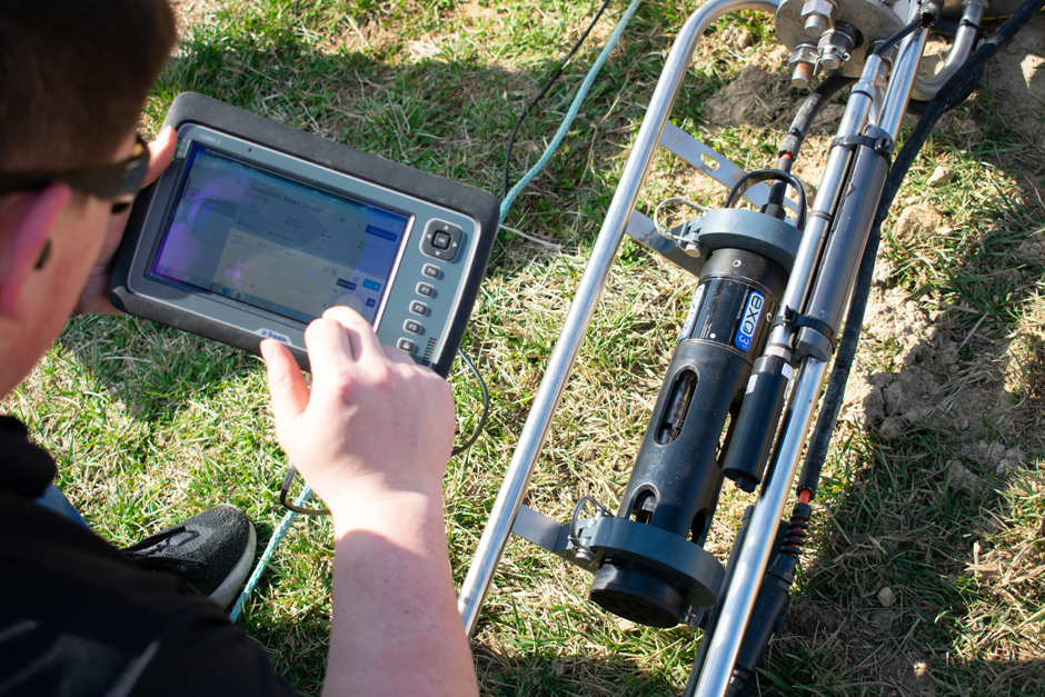 A Seametrics Turbo Turbidity Logger is mounted on an instrument cage for deployment in the Environmental Field Station pond.
