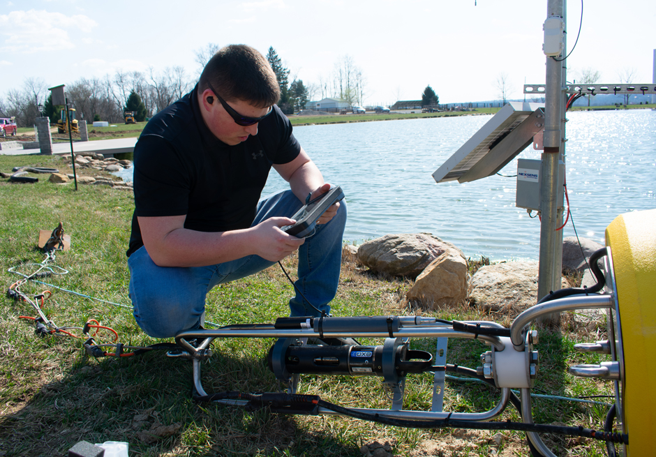 Environmental scientist, Joe Davidson, prepares the Seametrics Turbo Turbidity Logger for deployment on a NexSens Data Buoy.