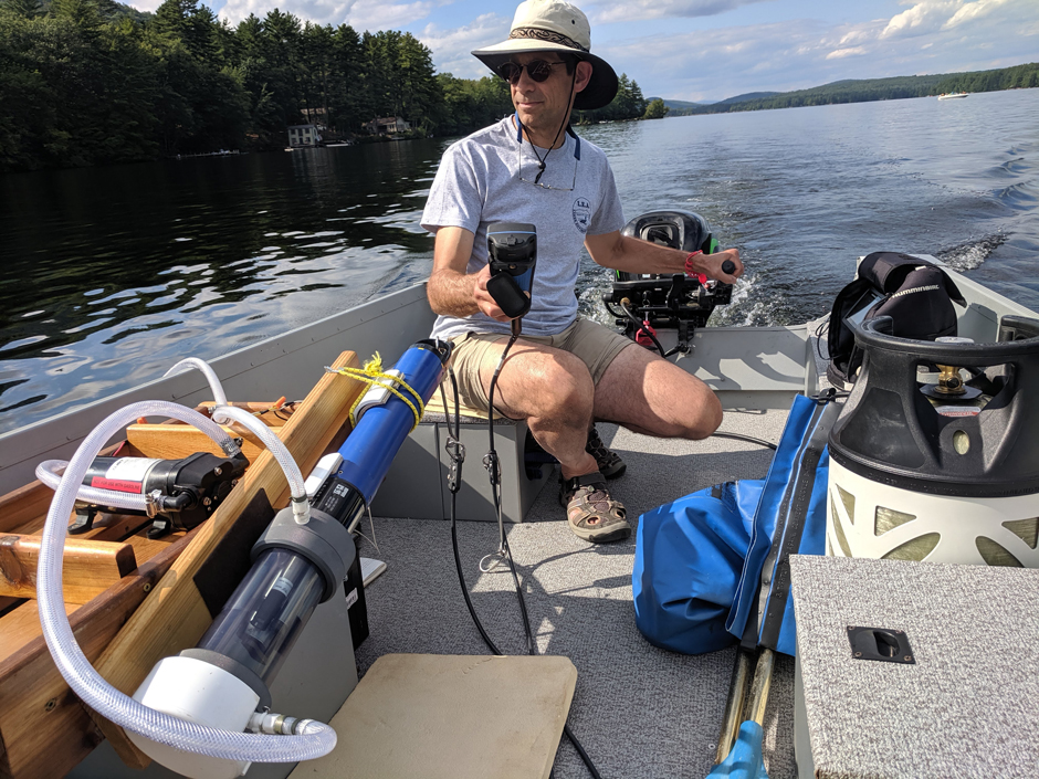 LEA Research Director Ben Peierls measuring surface water conditions on Moose Pond (Denmark, Maine) using a YSI EXO2 sonde and flow cell